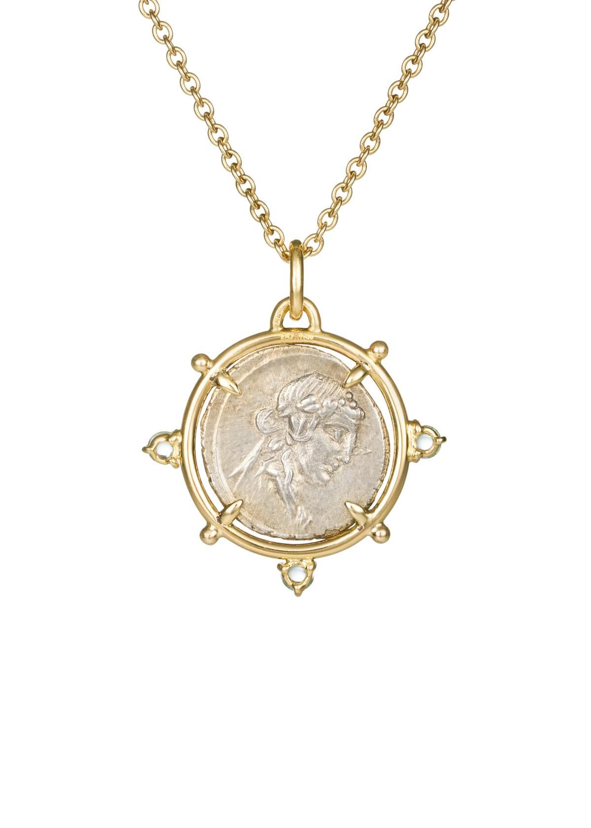 This DUBINI coin necklace from the 'Empires' collection features an authentic silver coin from Roman Republic dating circa 90 B.C. set in 18K yellow gold with aquamarine cabochons.

Coin Ø 19mm
Chain Length: 47cm

DEPICTED ON COIN: 
Obverse -