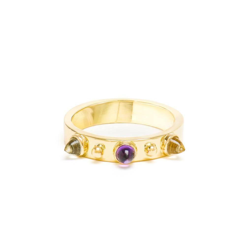 This DUBINI ring from the 'Empires' collection features our signature bullet cabochons set in 18K yellow gold.


…………………………………………………………………………………………………………………………………………………………………….

Punta di Diamante rings are to be worn on their own or stacked up to