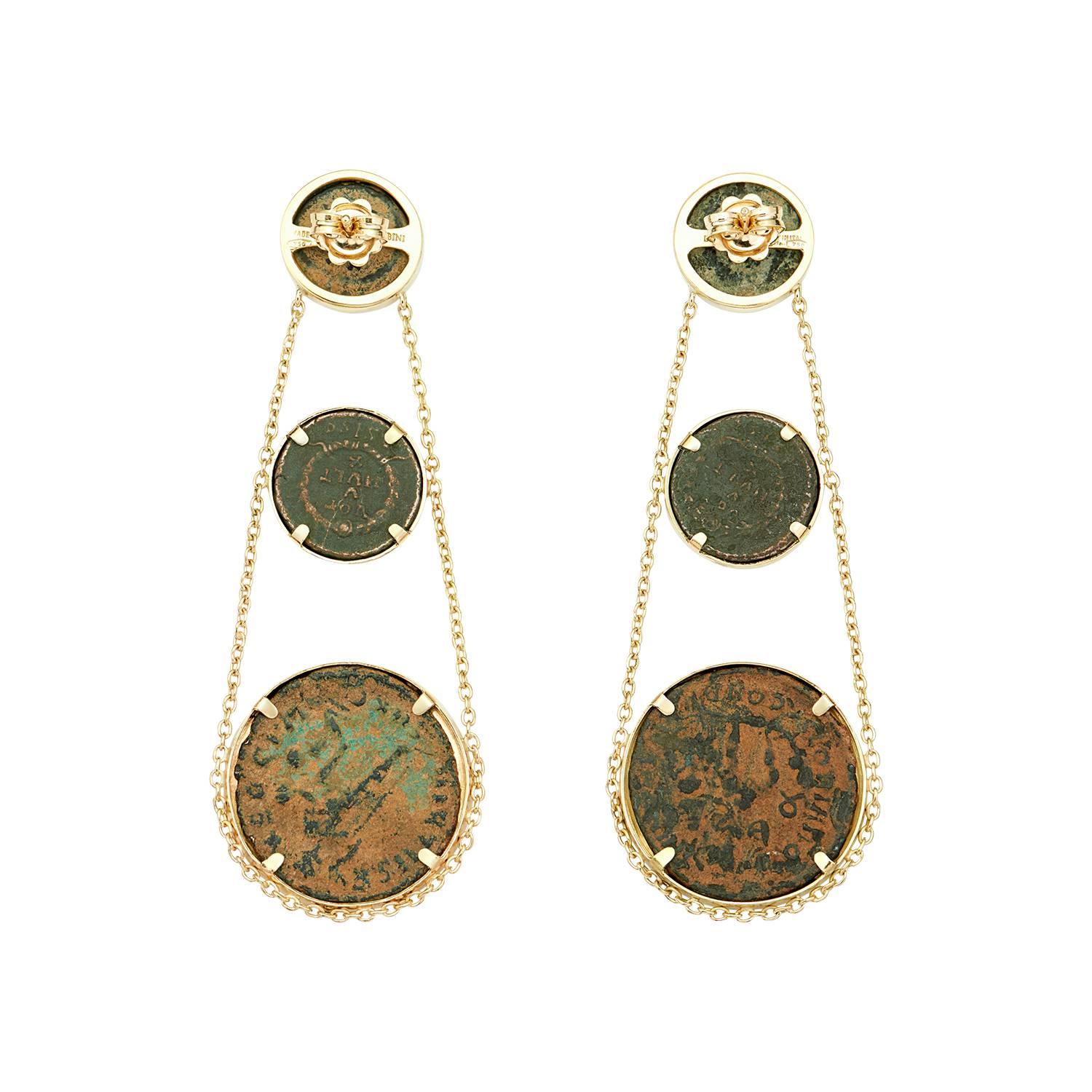 These Dubini coin earrings from the 'Empires' collection feature authentic Roman Imperial bronze coins set in 18K yellow gold.

Please note that we offer a bespoke service. Should you wish to customise your piece by selecting from our range of