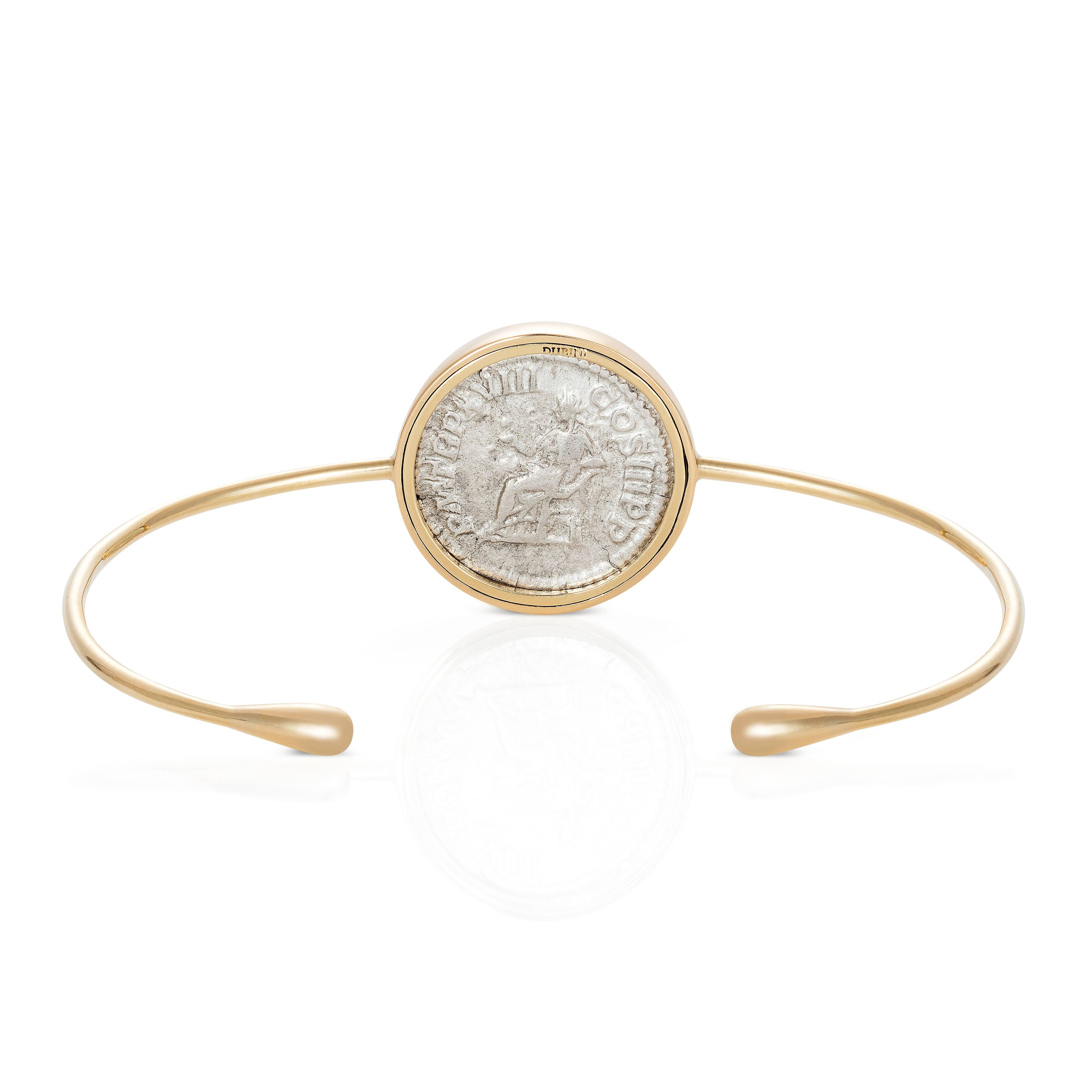 This DUBINI coin bracelet from the 'Empires' collection features an authentic Roman Imperial coin minted circa 210 - 211 A.D. set in 18K yellow gold.

* Due to the unique process of hand carving coins in ancient times, there may be a few stylistic