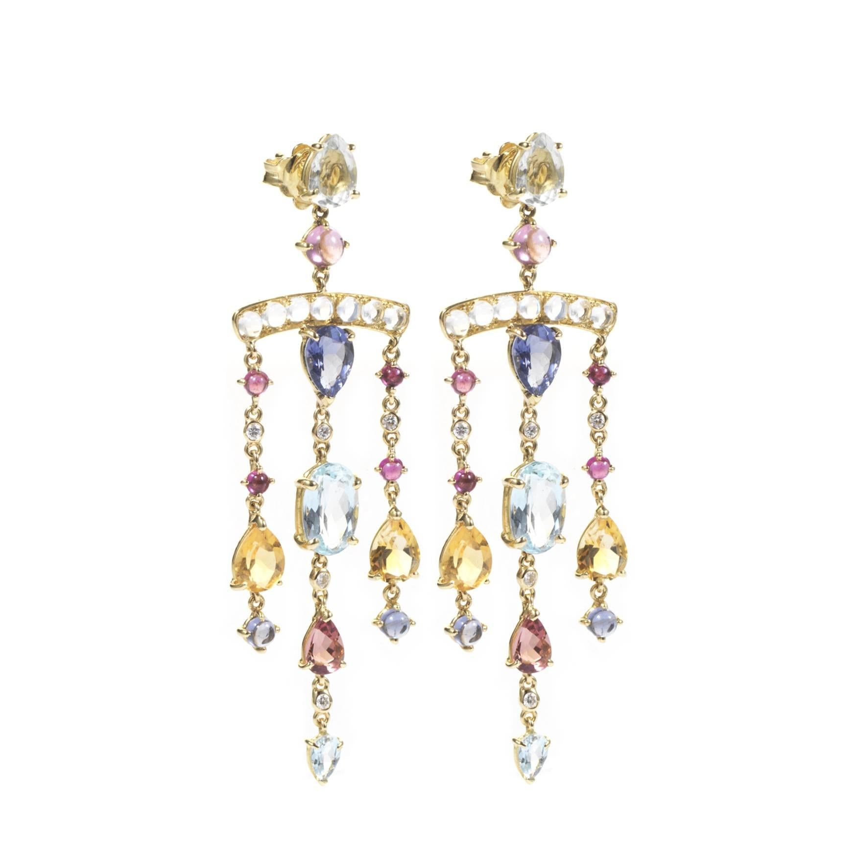 These DUBINI earrings from the 'Theodora' collection feature green amethyst, iolite, aquamarine, citrine, rubellite, moonstones and diamonds set in 18K yellow gold.

…………………………………………………………………………………………………………………………………………………………………….

Inspired by