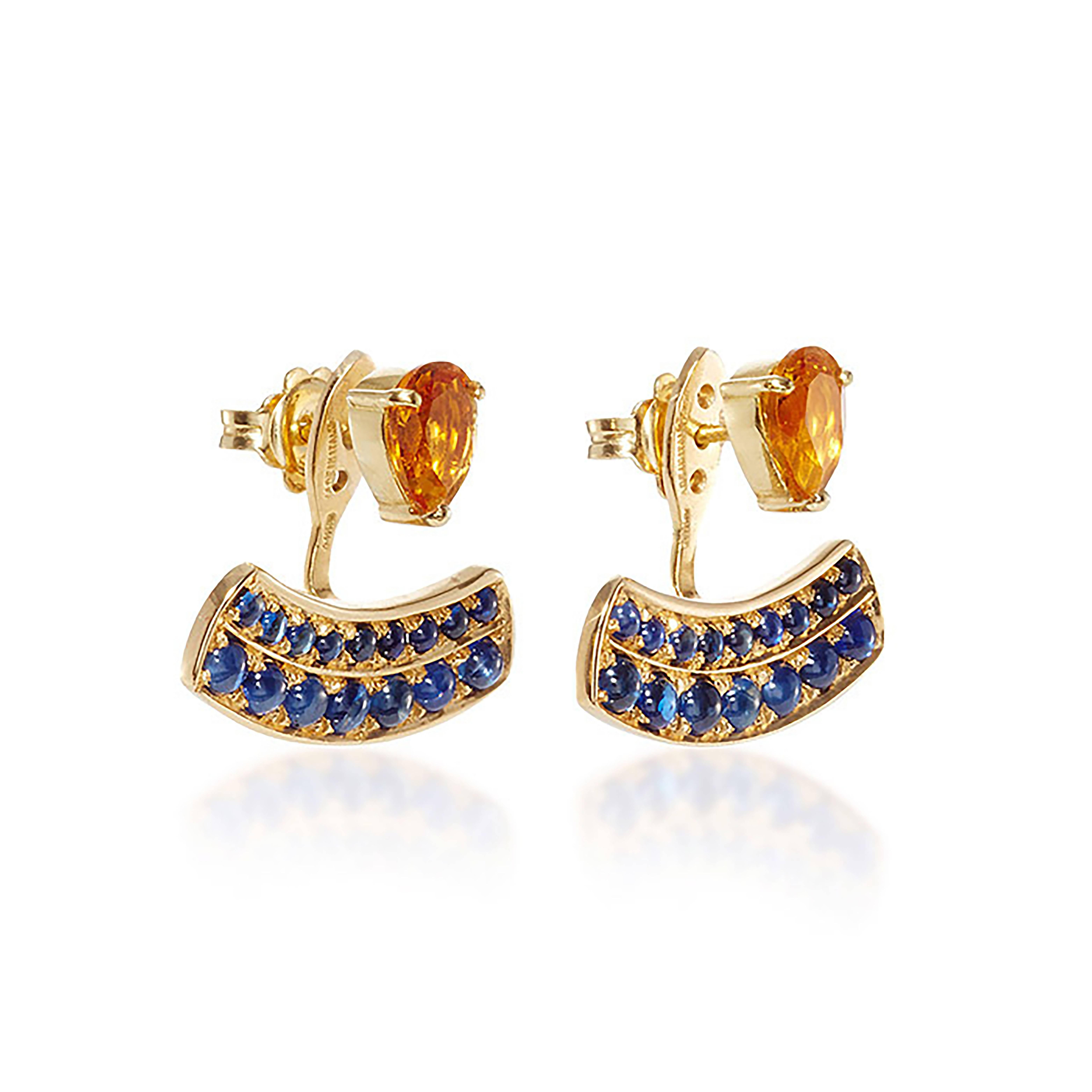 These DUBINI earrings from the 'Theodora' collection feature citrine drops with blue sapphire cabochons set in 18K yellow gold. 

Handmade in Rome, they are punctuated with three holes for an adjustable fit. Can be worn as a single stud or together