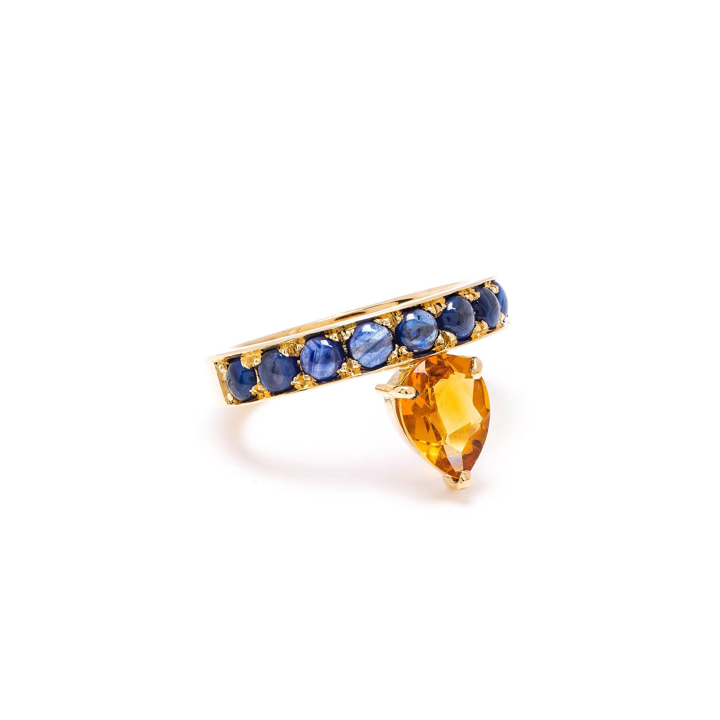 This DUBINI ring from the 'Theodora' collection features a citrine drop with sapphire cabochons set in 18K yellow gold. 

Ring size available: 51

The ring may be ordered in any size with a lead time of 2-3 weeks.

Please note that we offer a