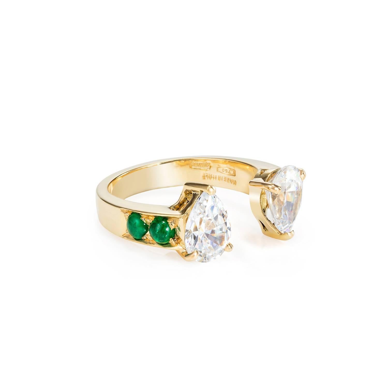 This DUBINI ring from the 'Theodora' collection features zircon drops with emerald cabochons set in 18K yellow gold.

Ring size available: 52 (US 6) 

The ring may be ordered in any size with a lead time of 2-4 weeks.

Zircons may be substituted