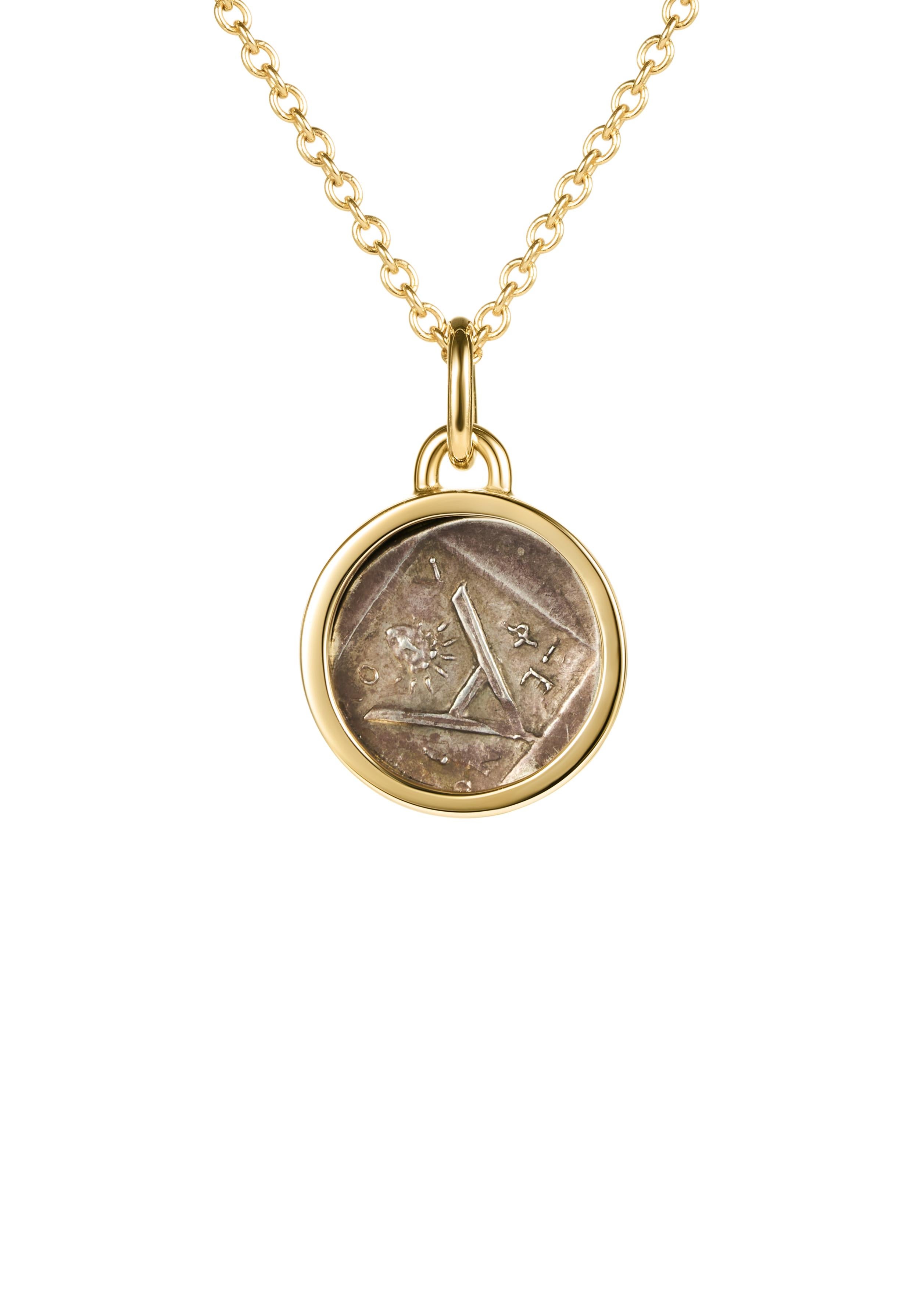 This unique DUBINI necklace showcases an authentic silver hemidrachm coin set in 18K yellow gold. 

COIN SPECIFICATIONS:

- Diameter: Ø 16mm

HISTORY:

A majestic wolf is depicted on the obverse, its forepart advancing to the right, symbolising