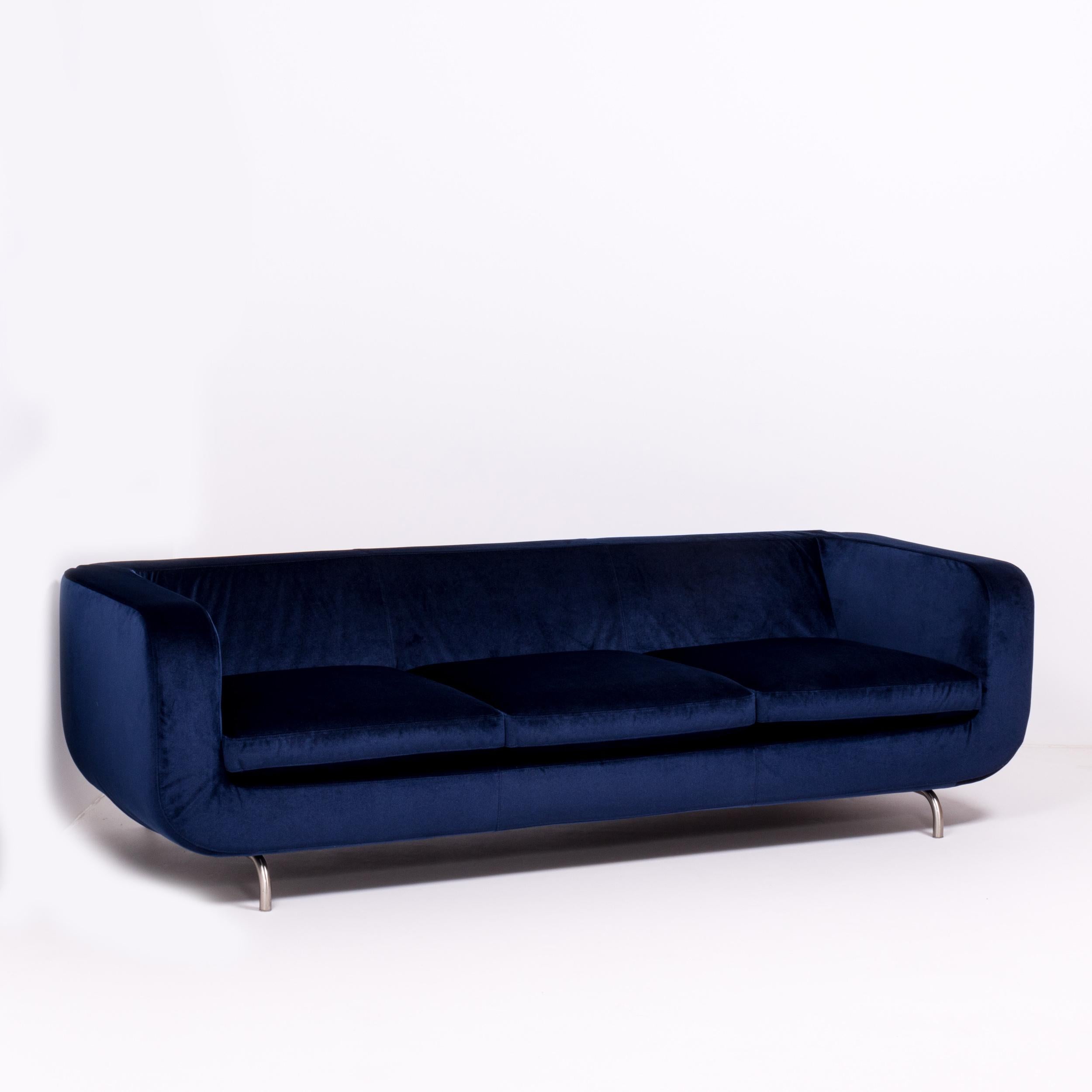 Combining modernist curves with sleek straight lines, this Dubuffet three-seat sofa was designed by Rodolfo Dordoni for Mintotti. 

The sculptural sofa has been newly reupholstered in a plush, royal blue velvet. The cover can be removed with two