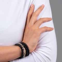 Pulsera de Oro Rojo con 17 Diamantes talla Rosa de 14, 50ct. y Cuentas de Ónice.