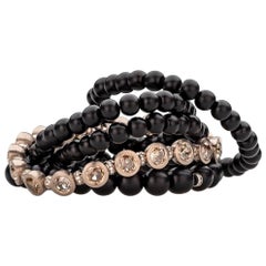 Bracelet in Red Gold with 17 Diamonds Rose Cut 14, 50ct. and Onyx Beads.