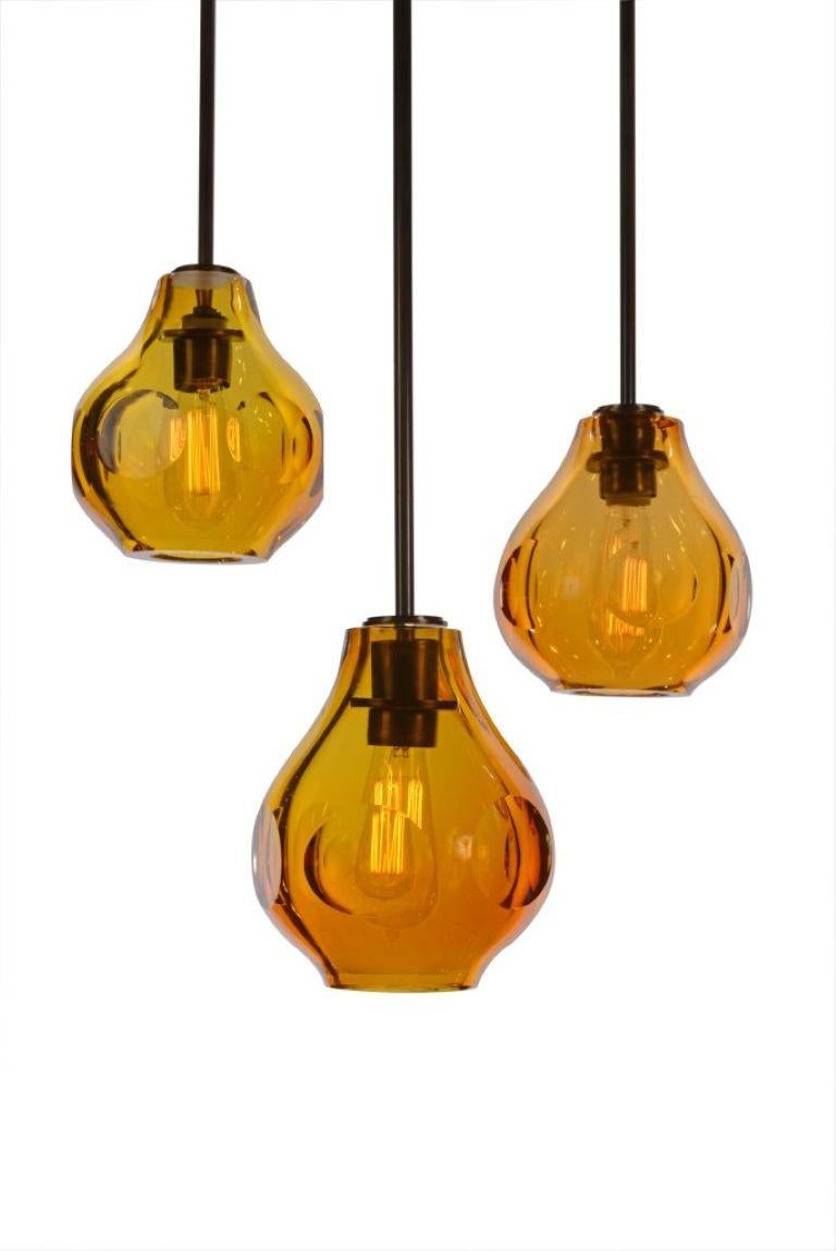 Hanging light has a hand blown crystal shade with diamond honed facets in FIVE color shades. Mix and match designs and colors to fit your inspiration, your home your life.

Each hand polished facet reflect and reveals the light within. An