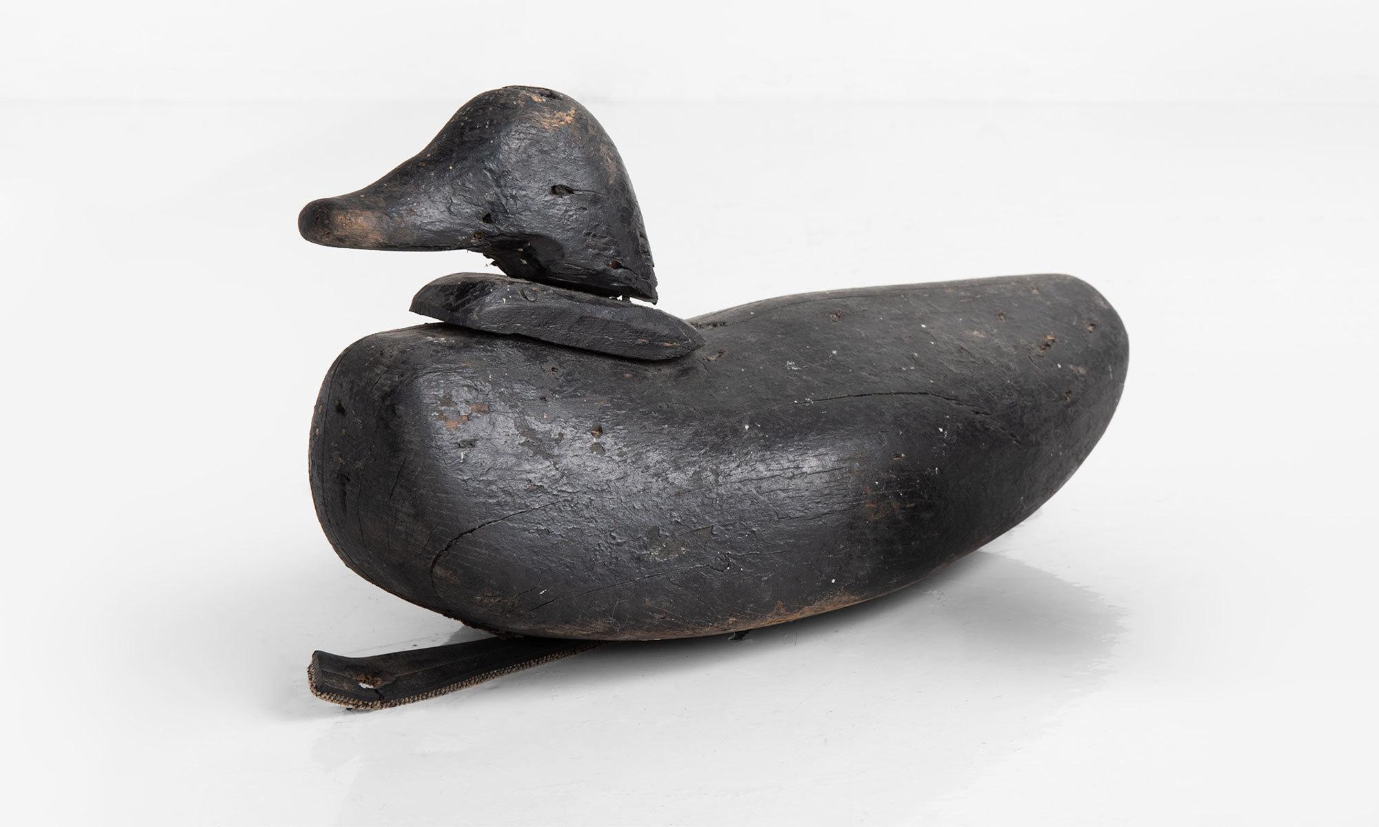 Duck decoy, circa 1900.

Includes original paint and rubber strap.

Only (1) available.