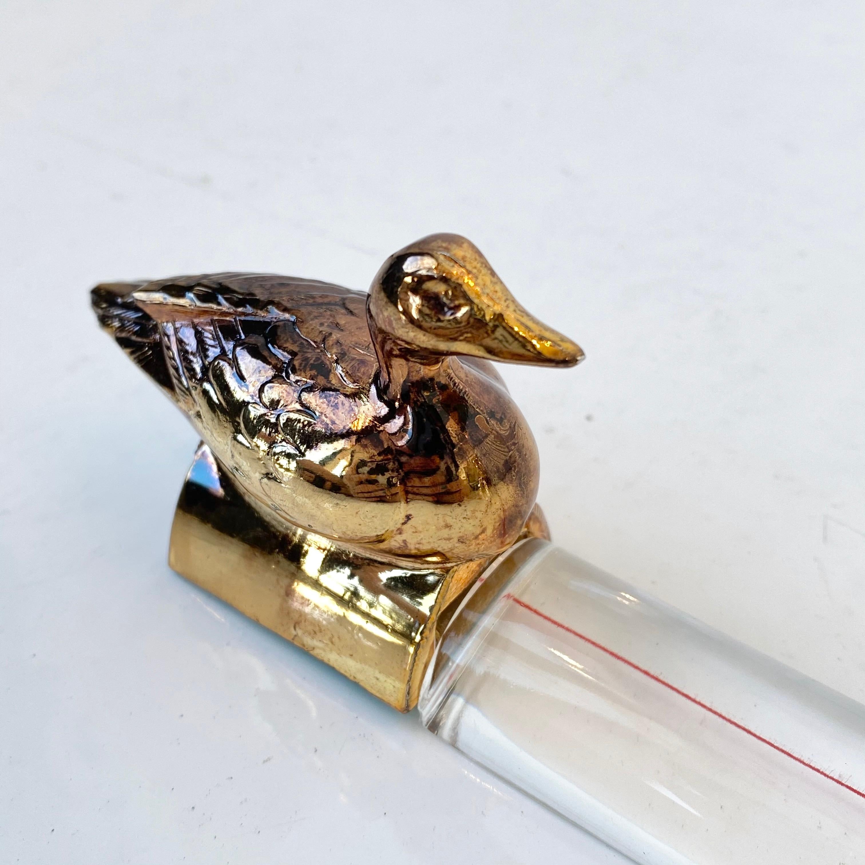 Cool vintage desk loupe with brass colored duck. Working magnifying glass and paperweight. Made of metal and glass. Label on bottom reads 