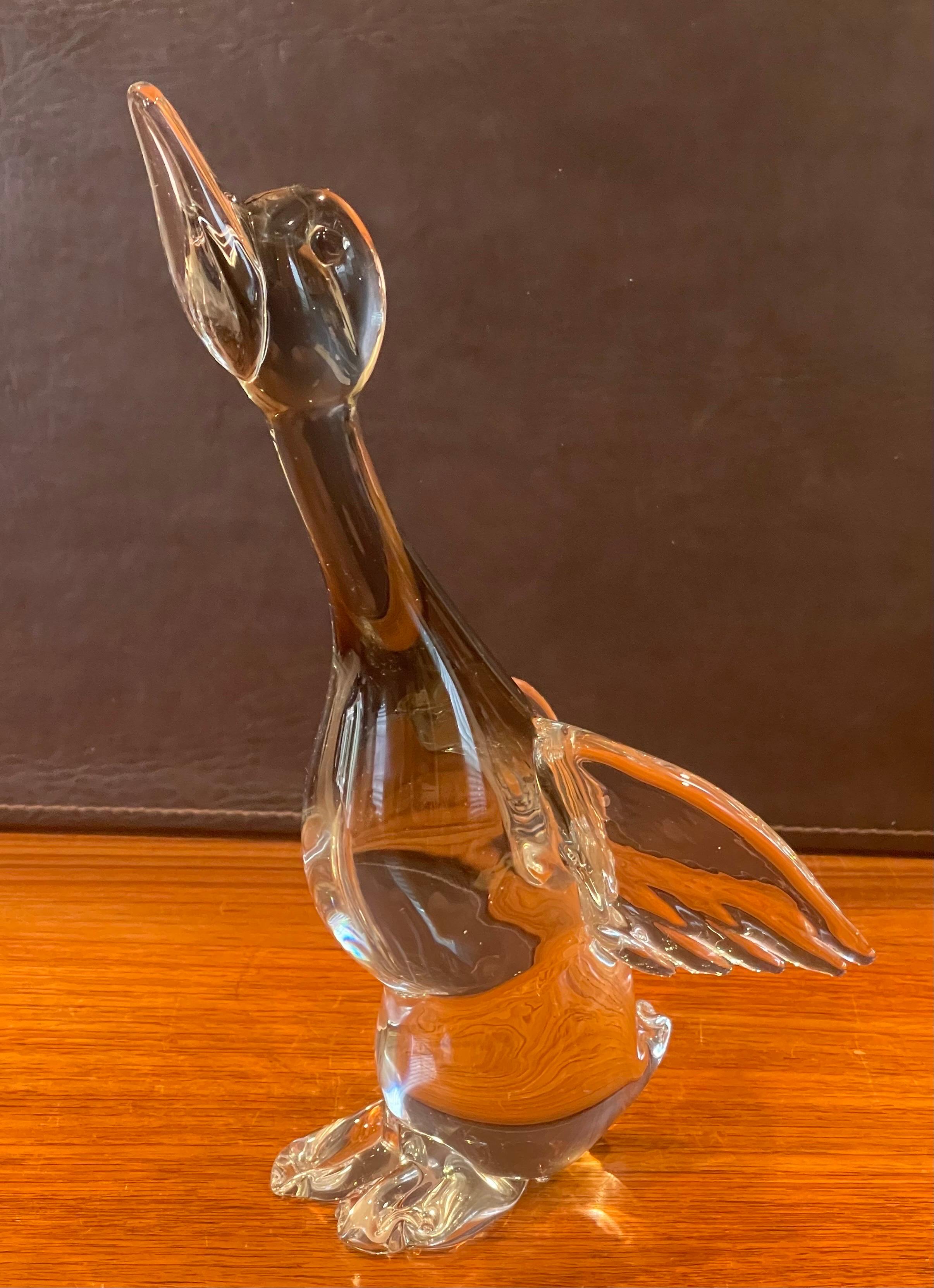 Majestic duck in flight art glass sculpture by Murano Glass, circa 1990s. The beautiful piece is clear glass with black sommerso in the body of the duck; really cool and realistic piece that measures 5.5