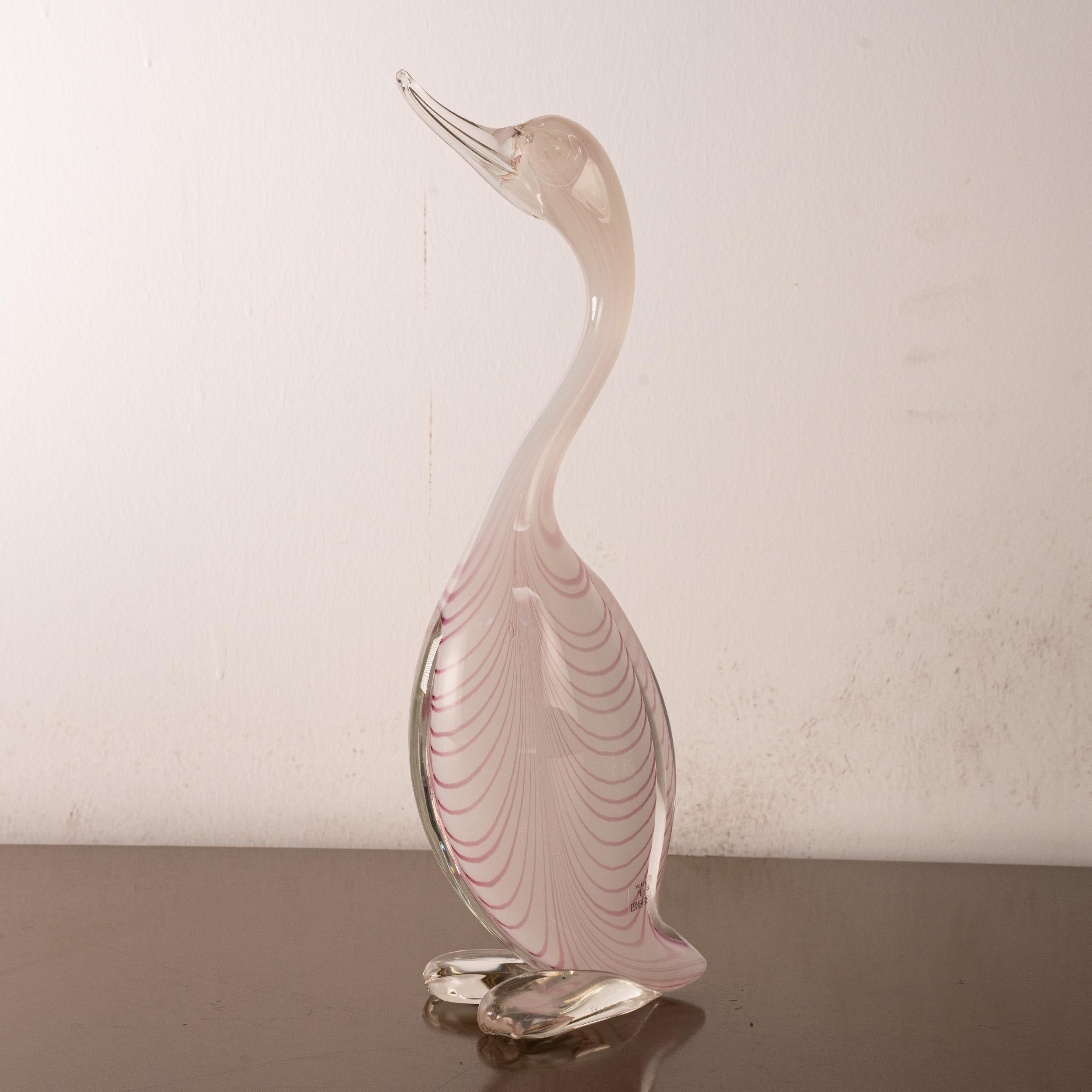 Elegant Murano glass sculpture depicting a stylized duck, handcrafted in Italy using the fenicio technique. This particular piece features a refined combination of milky white opaline and soft pink glass accents.

The fenicio (or 