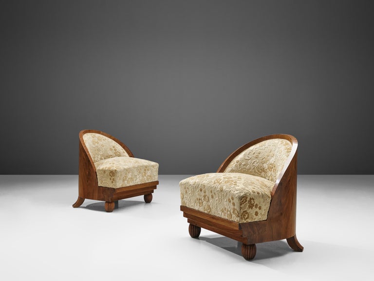 Ducrot Studio, lounge chairs, walnut and fabric upholstery, Palermo, 1930

Elegant Art Deco lounge chairs by Ducrot Studio. These chairs are upholstered in a cream colored fabric with a floral design. The backs of these chairs display the warmth