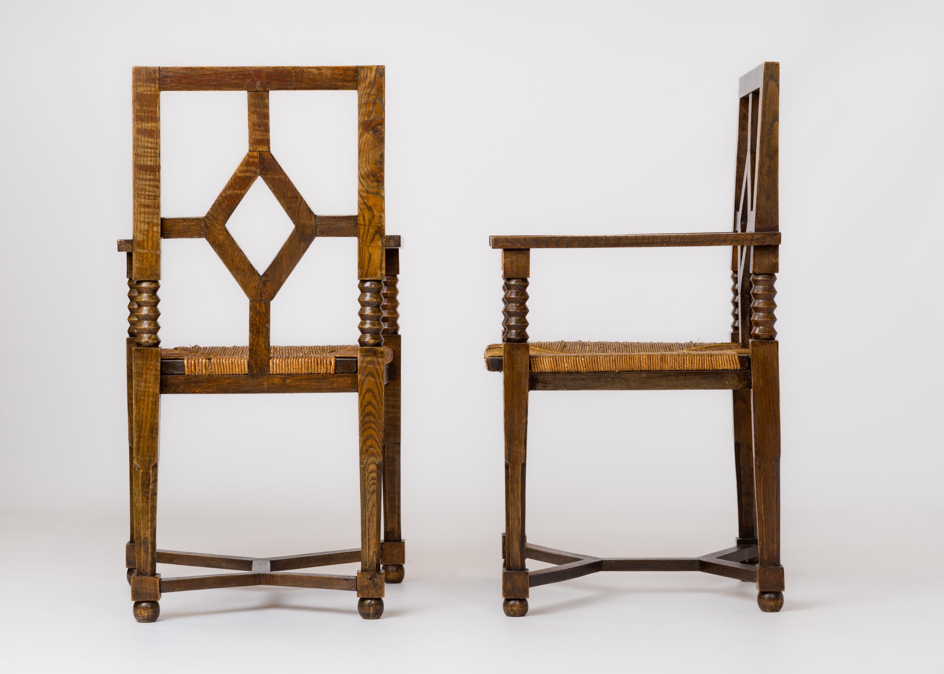 Dudouyt Inspired Regionalist Armchairs in Stained Oak & Rush - France 1940's In Fair Condition For Sale In New York, NY