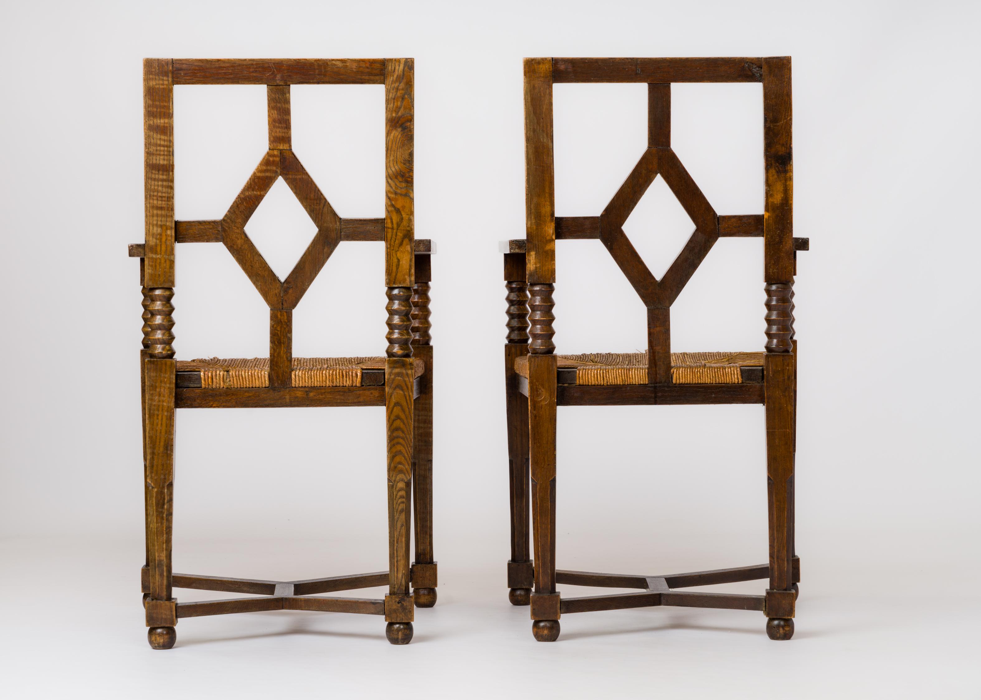 Mid-20th Century Dudouyt Inspired Regionalist Armchairs in Stained Oak & Rush - France 1940's For Sale