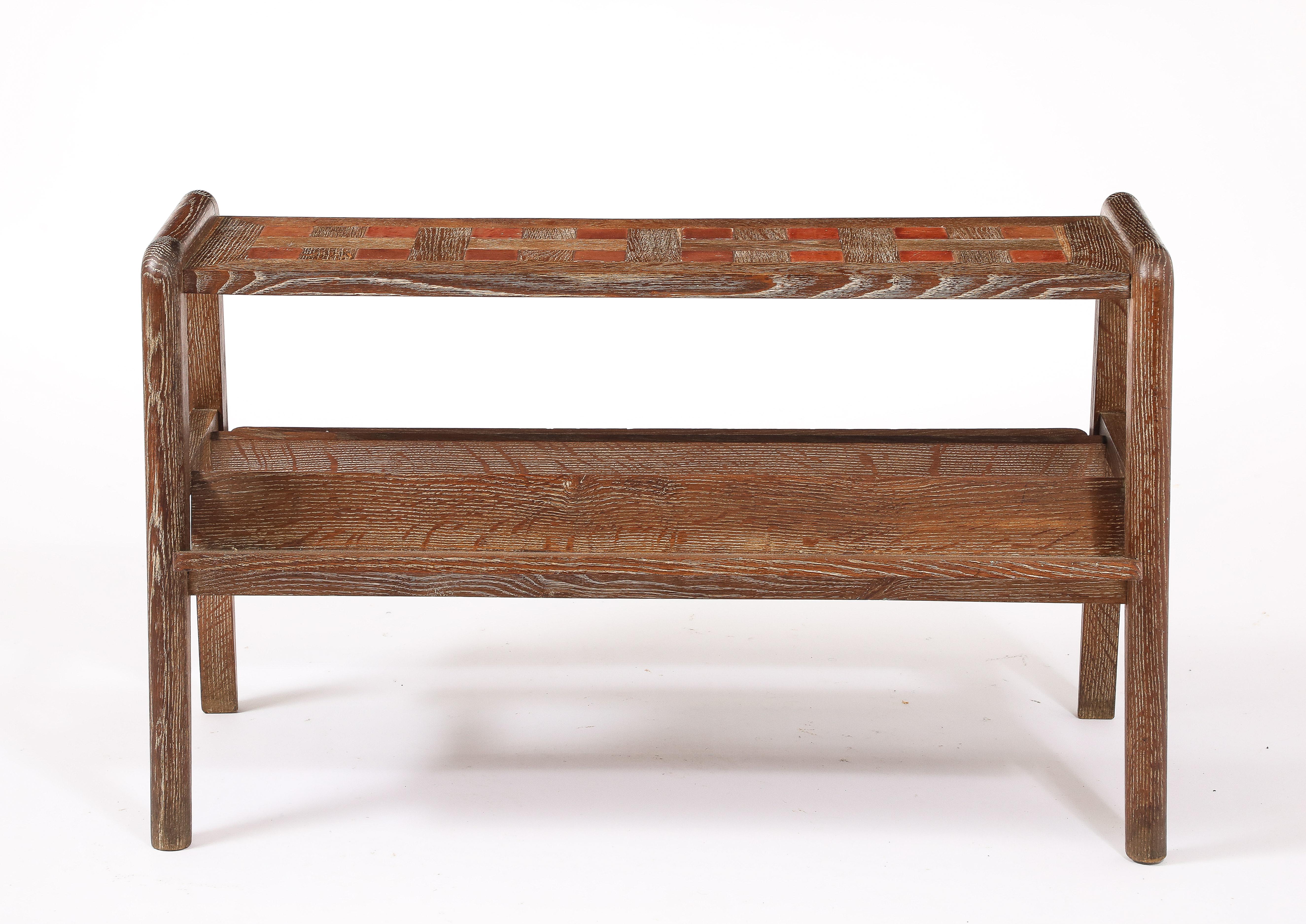 Compass table in oak with a double sided book holder, its top having the unusual feature of being a marquetry of oak and thick leather tiles.