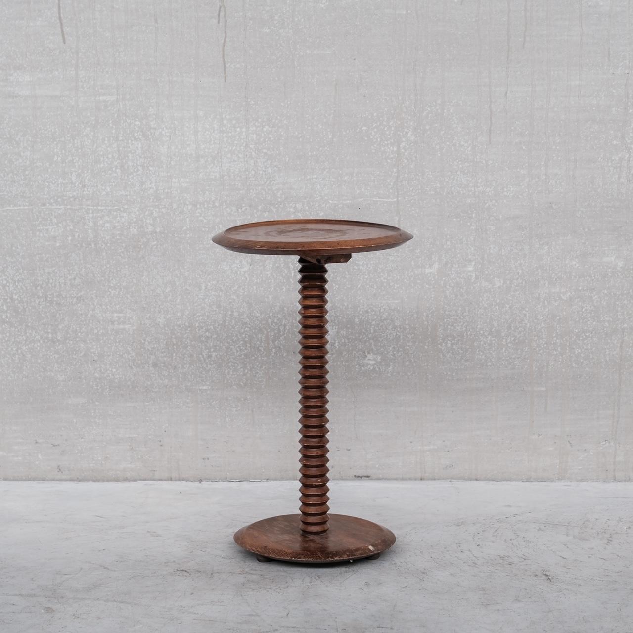 A turned wooden side table (ideal as a wine table). 

France, c1950s. 

In the style of Charles Dudouyt. 

Characteristic turned wooden stem. 

Some wear to the top, which we can restore upon request inclusive of the price. 

Location: Belgium