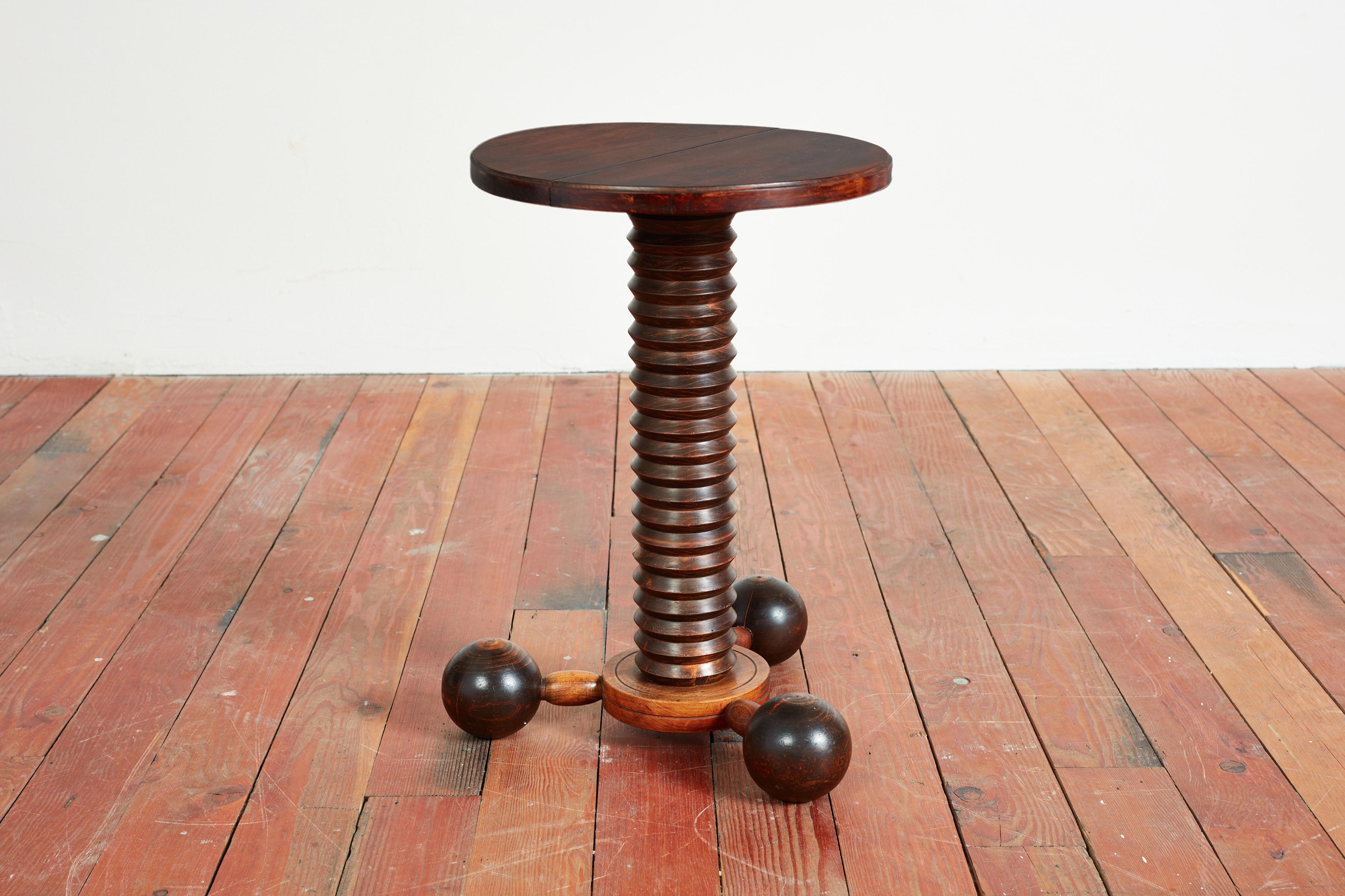 Charles Dudouyt side table with signature corkscrew base / large tripod base with carved ball shape. 
Taller in scale with great patina throughout.