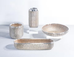 Two baskets, a wine chiller, and a bottle holder, designed by Lino SABATTINI. Italy, 70s