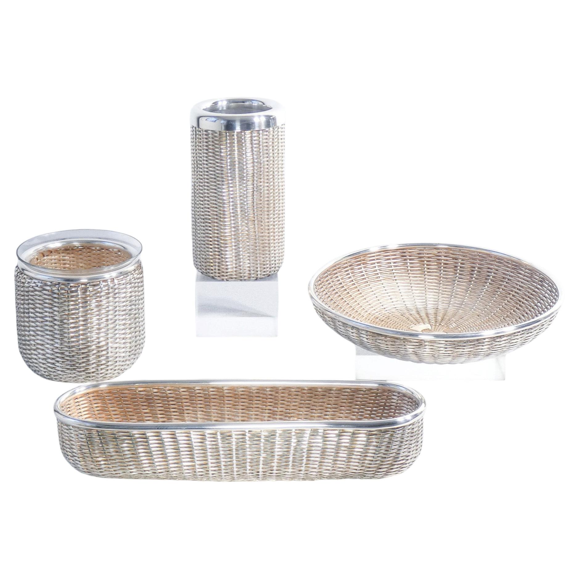 Two baskets, a wine chiller, and a bottle holder, designed by Lino SABATTINI. Italy, 70s