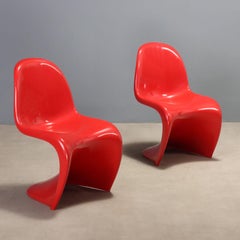 Two red "Panton Chairs" by Verner Panton, manufactured by Herman Miller in the 1970s