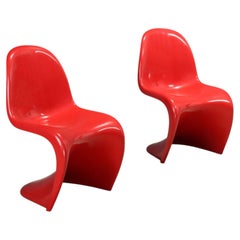 Two red "Panton Chairs" by Verner Panton, manufactured by Herman Miller in the 1970s