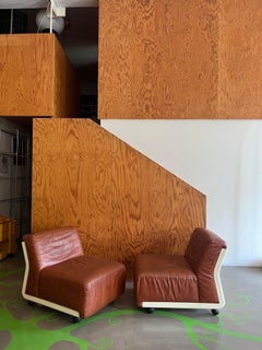 Two Amanta 24 cognac-colored leather armchairs design by M. Bellin fori B&B Italia