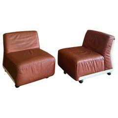 Two Amanta 24 cognac-colored leather armchairs design by M. Bellin fori B&B Italia