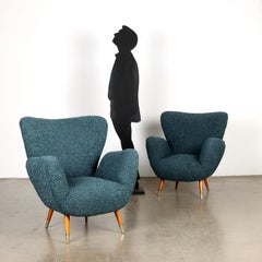 Two 1950s Argentine manufacture oil-colored armchairs