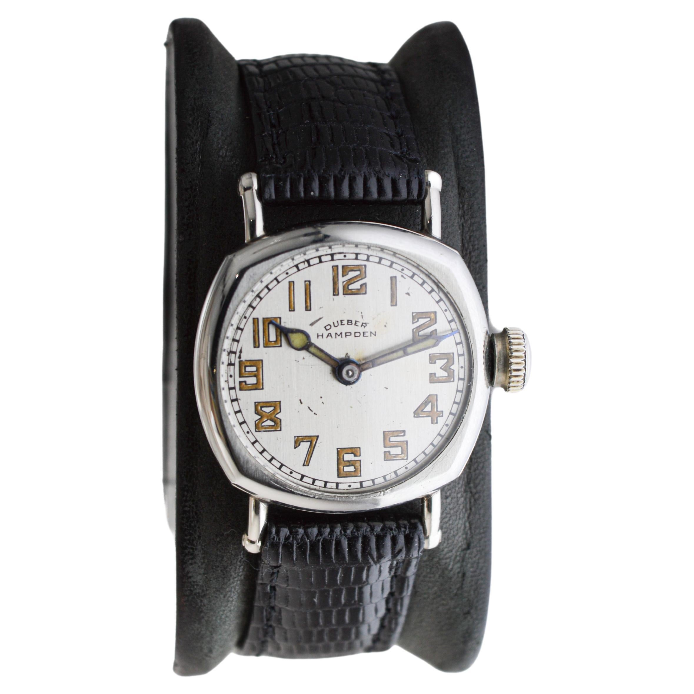 FACTORY / HOUSE: Dueber Hampden Watch Company
STYLE / REFERENCE: Cushion Shaped / Military Style 
METAL / MATERIAL: Nickel Silver
CIRCA / YEAR: 1920's
DIMENSIONS / SIZE: Length 28mm X Diameter 35mm
MOVEMENT / CALIBER: Manual Winding / 15 Jewels /