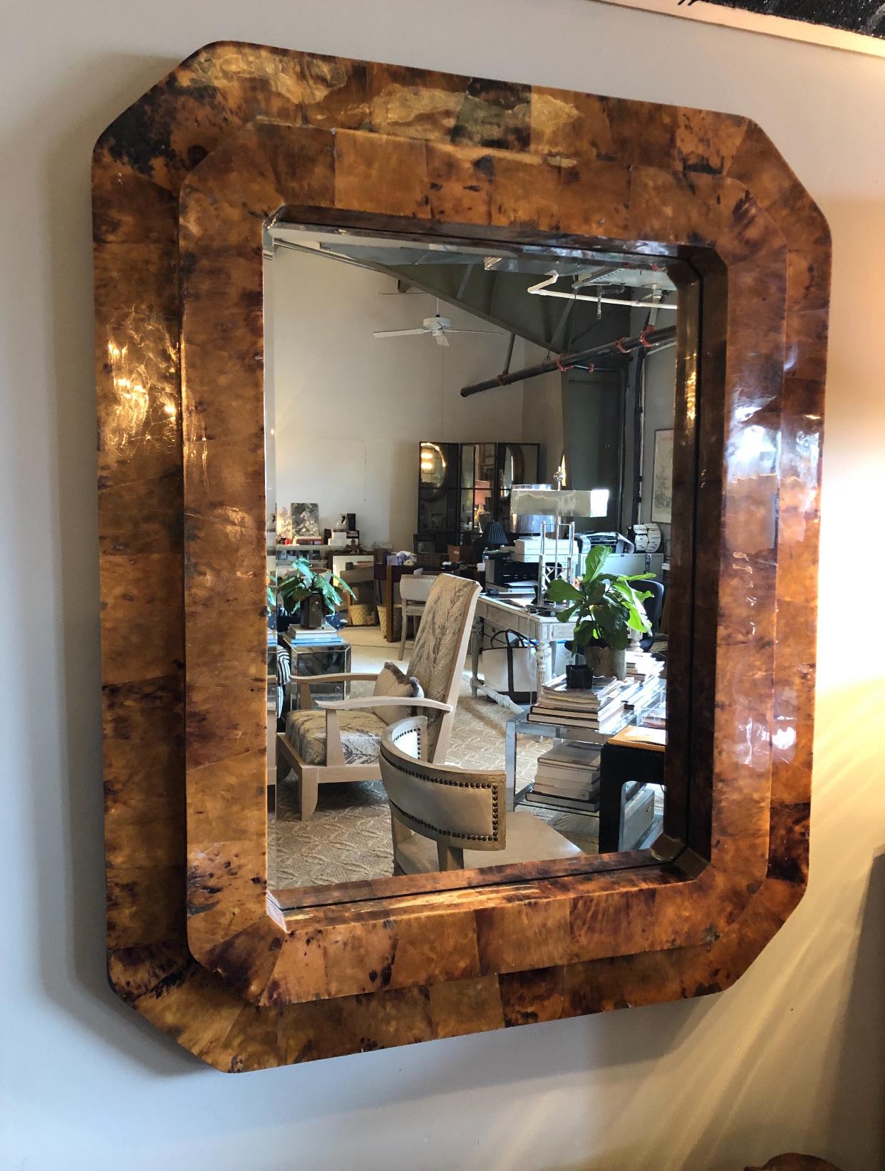 This fabulous 1980s lacquered tortoise shell mirror would look great above a fire place or in a study. It's a great masculine, vintage look.