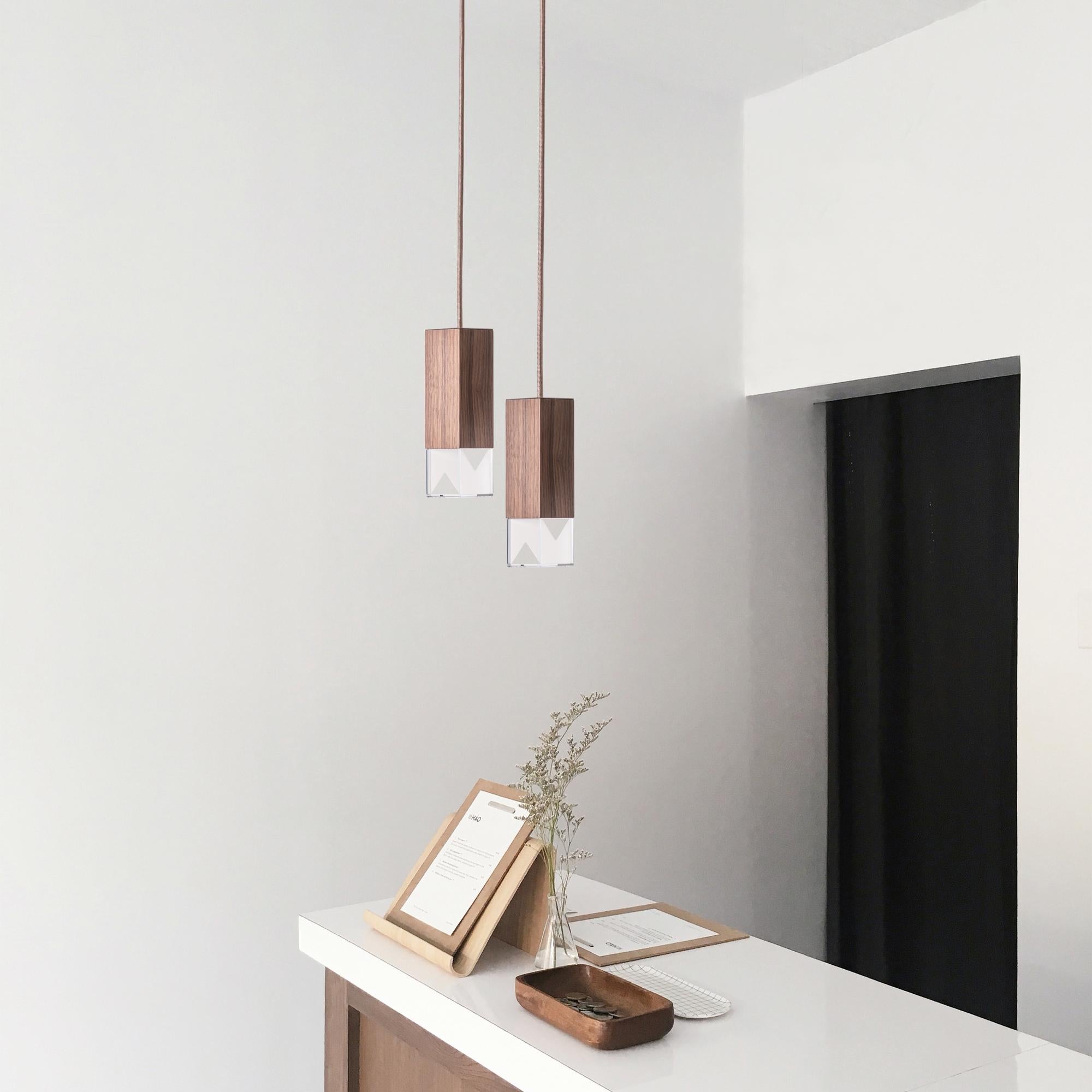 Lamp/one wood duet chandelier by Formaminima

This chandelier is made of two pendant lamps in walnut.
Made in Italy.

Lamp body available in solid Canaletto walnut, oil finish.
Ultra-thin anti-reflection crystal diffuser. Inside-diffuser Limoges