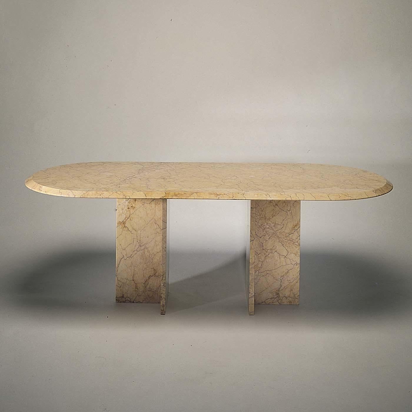 Simple, essential silhouette combined with precious material are at the core of this visually striking design by Achille Castiglioni. Made entirely of Crema Valencia marble, with its yellow warm color and fine, intense veining and golden shading,