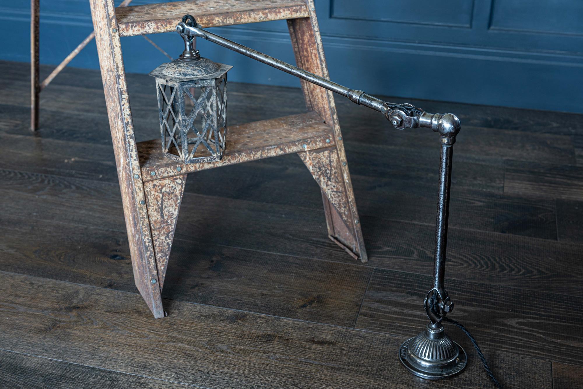 Dugdills polished Anglepoise lantern lamp, circa 1920
Makers stamp to base; ‘Dugdills Patent’. An unusual example with a fragile lattice lantern shade. Showing splits and creases but does not detract from the interesting form, aged patina and
