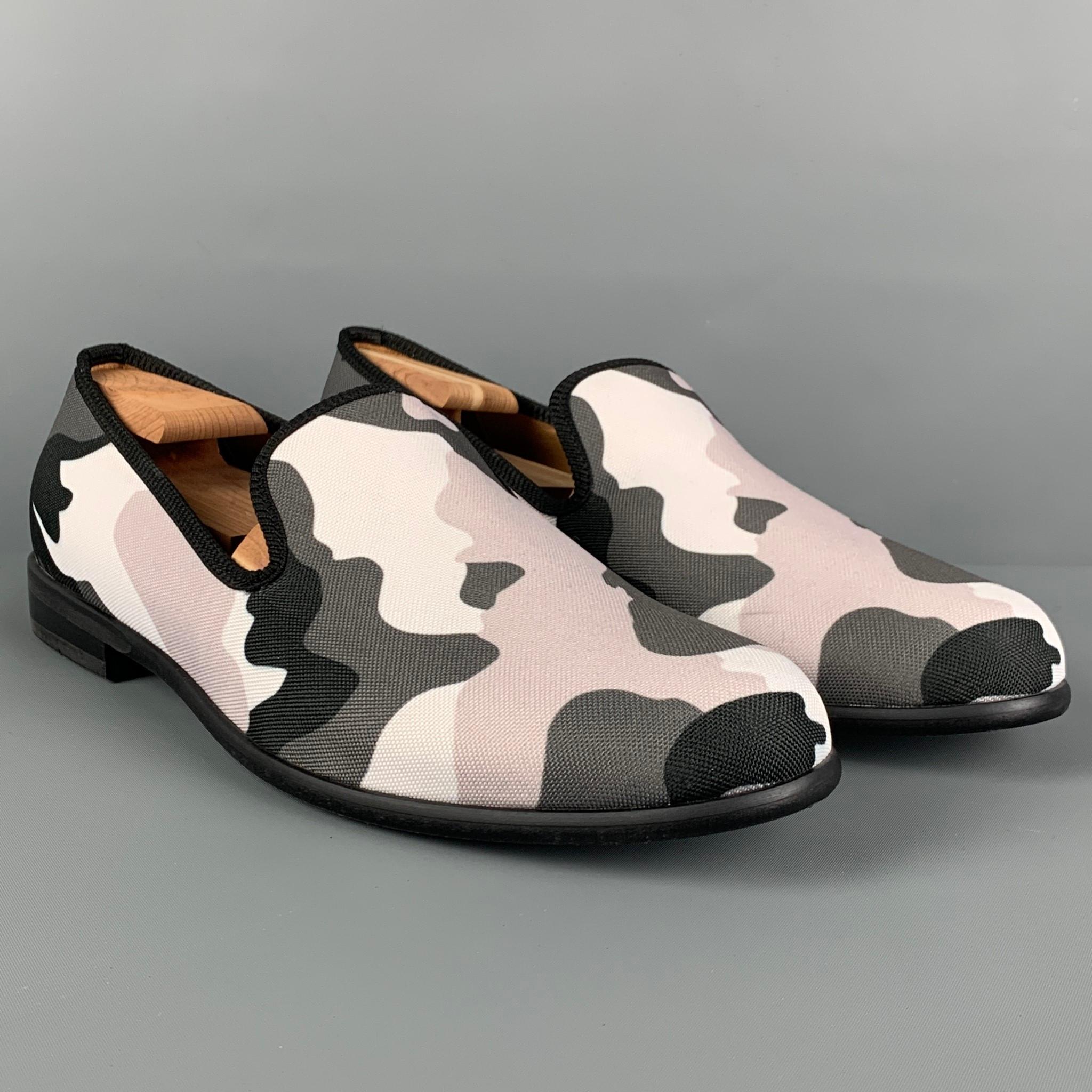 DUKE + DEXTER loafers comes in a grey & white camouflage canvas featuring a slip on style. Handmade in England.

Very Good Pre-Owned Condition.
Marked: 11

Outsole: 12 in. x 4 in. 