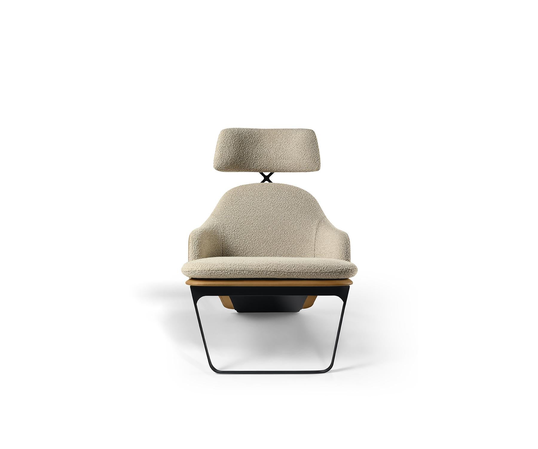 The Duma lounge chair reflects the Dialogue collection's innovative spirit, combining precision with the warmth of rich materials.

Its curved boucle-upholstered seat pairs with a sculpted leather backrest for comfort and support, with a sleek metal