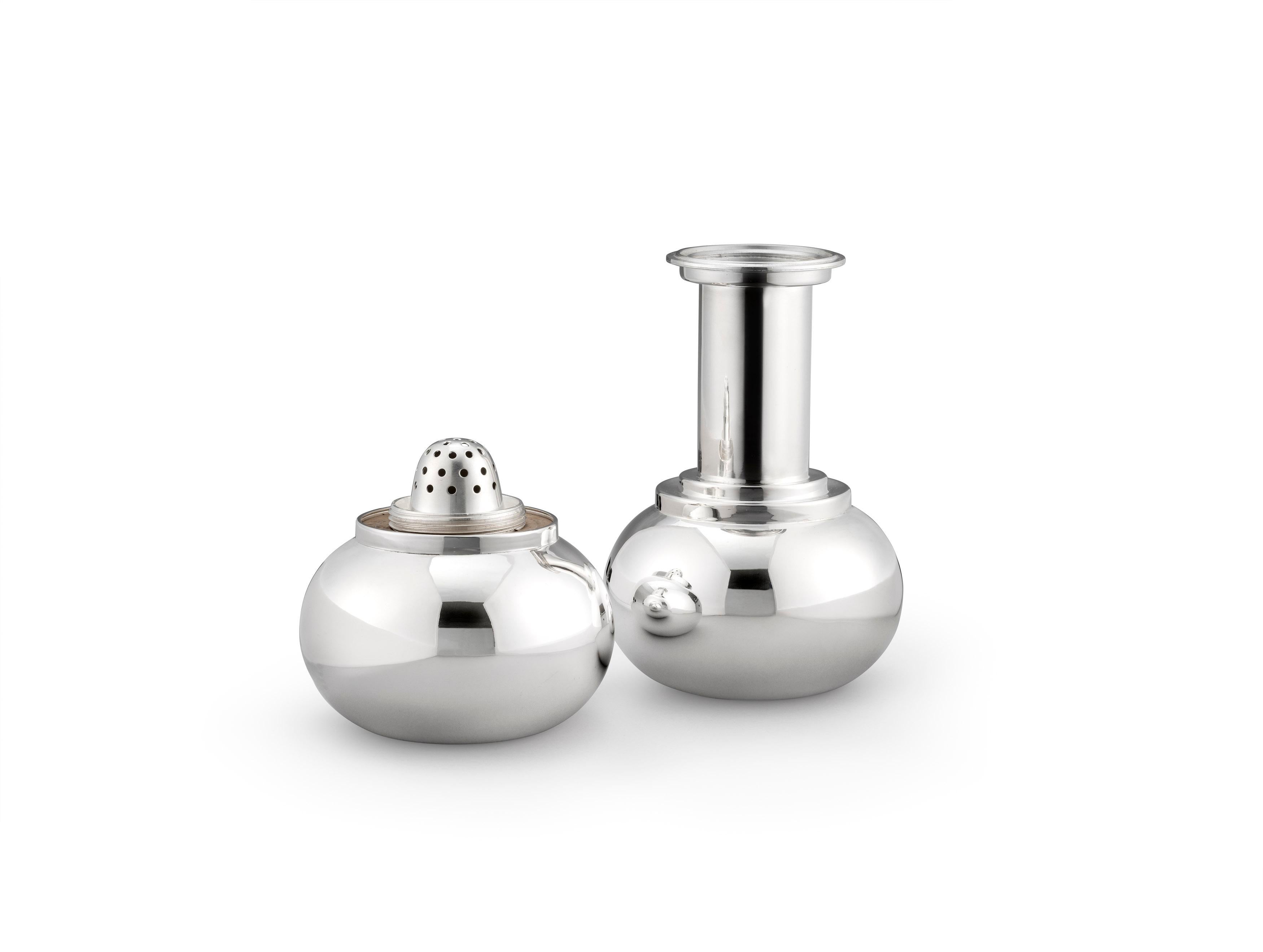 A silver-plated cocktail shaker in the form of a dumb-bell. In the 1930s, Asprey & Co. Commissioned and sold a range of various novelty shape cocktail shakers, including a handbell and fire extinguisher. The dumb-bell Shaker makes a very good bar