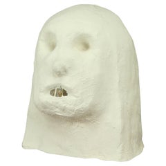 Sculpture de tête muette en ciment
