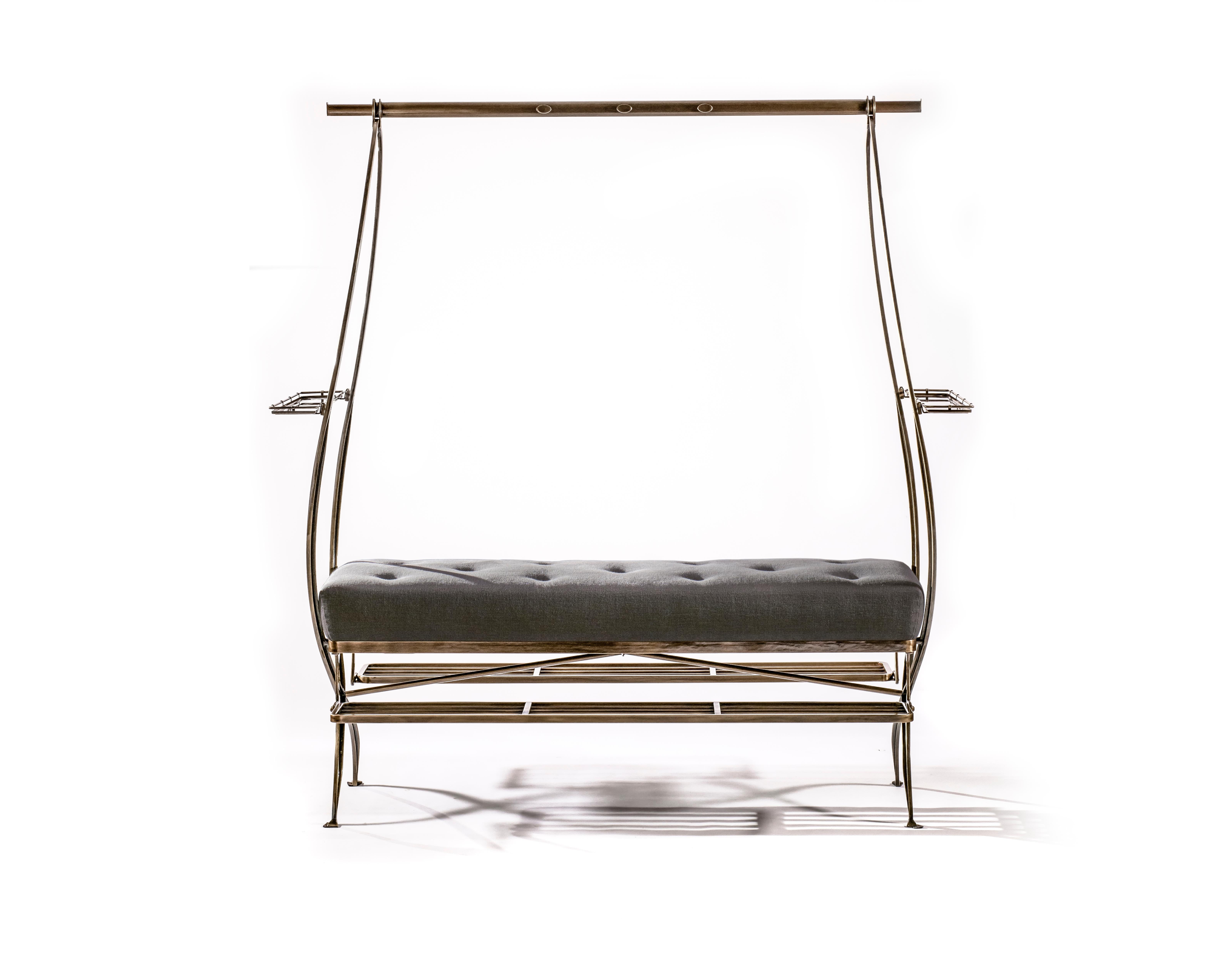Bronze-plated steel framed dressing bench with upholstered seat, extending superstructure and foldable footrests.

B.B. - The sinuous form merges into perfect valet function. This piece works well when placed centrally in a dressing room where it