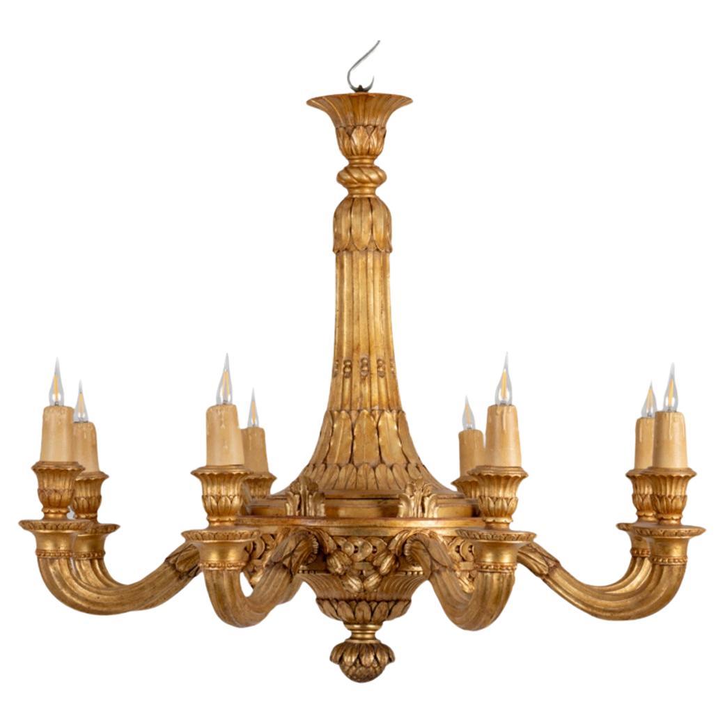 Dumez, Louis XVI style chandelier in carved and gilded wood. 1950s. For Sale