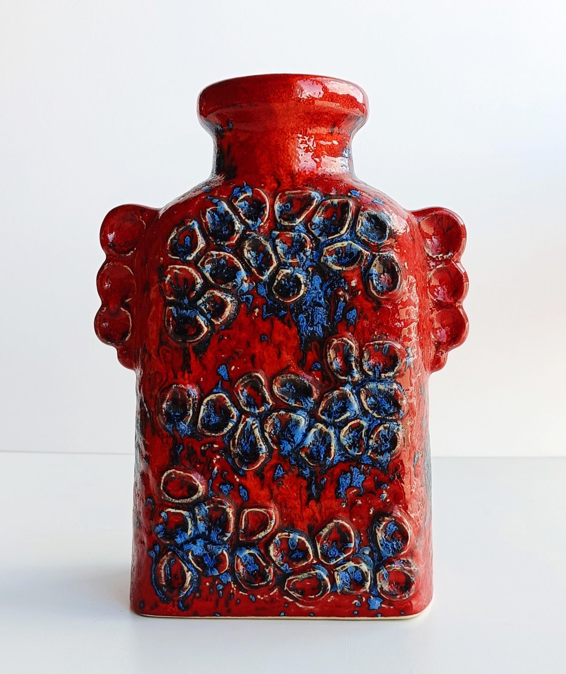 Red Domino decor Dümler & Breiden ceramic vase . Handcrafted in West Germany circa 1960s. Signed and numbered.

The glazing colours, decoration and shape are stunning. Spectacular in the hand. In flawless perfect condition.

The Domino decor vases