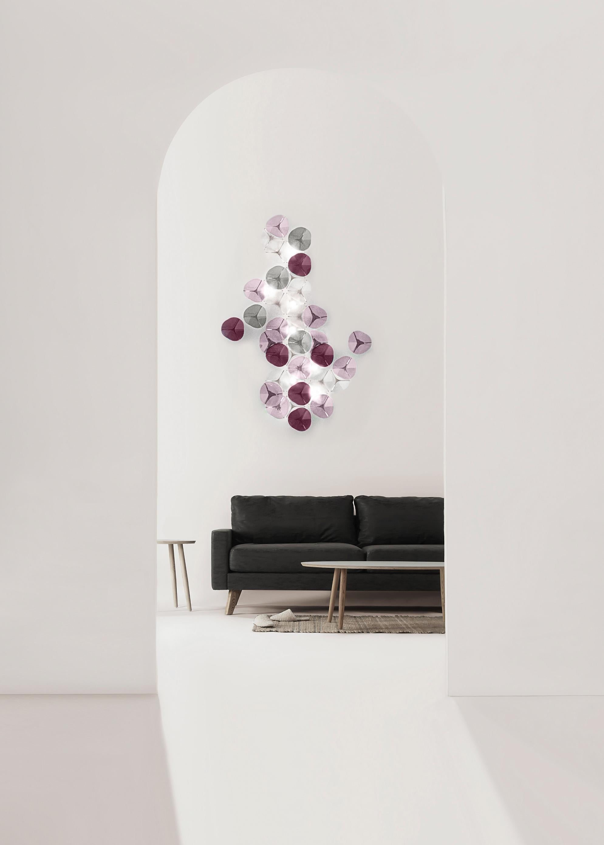 The DUNA wall light is a composition of 40 softly curved, artisan glass pieces. Their abstract shape gives a modern touch to the DUNA compositions
There are 3 color palettes available and other combinations on demand.
The colored artisan glass