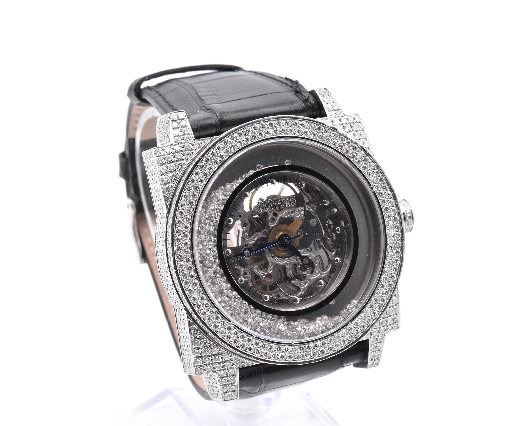 Movement: automatic
Function: hours, minutes, seconds
Case: 47mm stainless steel approximately 20 carats of diamonds set in the case and bezel, sapphire protective crystal, water resistant to 100m, skeleton case back, push/pull crowtn
Band: generic
