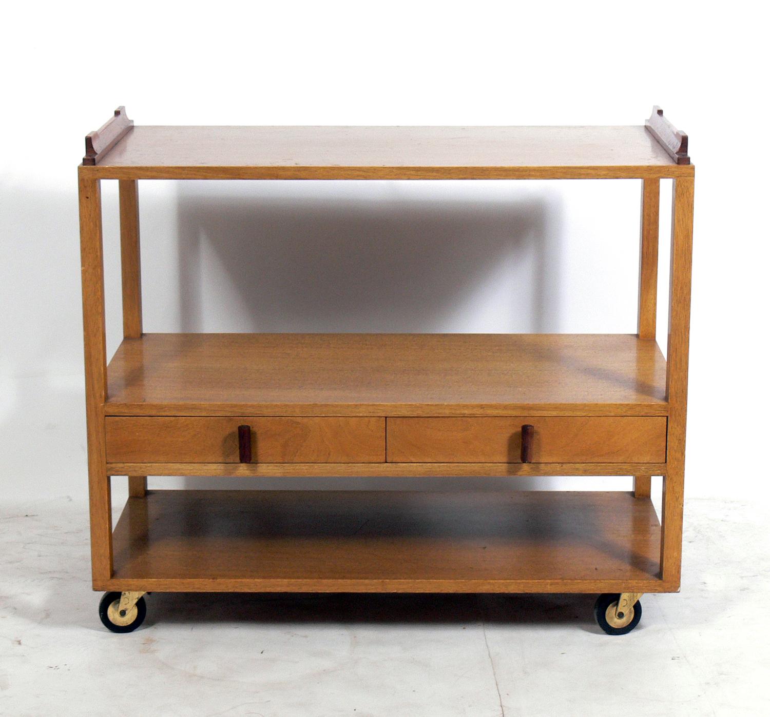 Clean lined bar or serving cart, designed by Edward Wormley for Dunbar, American, circa 1950s. This piece is currently being refinished and can be completed in your choice of color. The price noted includes refinishing in your choice of color. It is