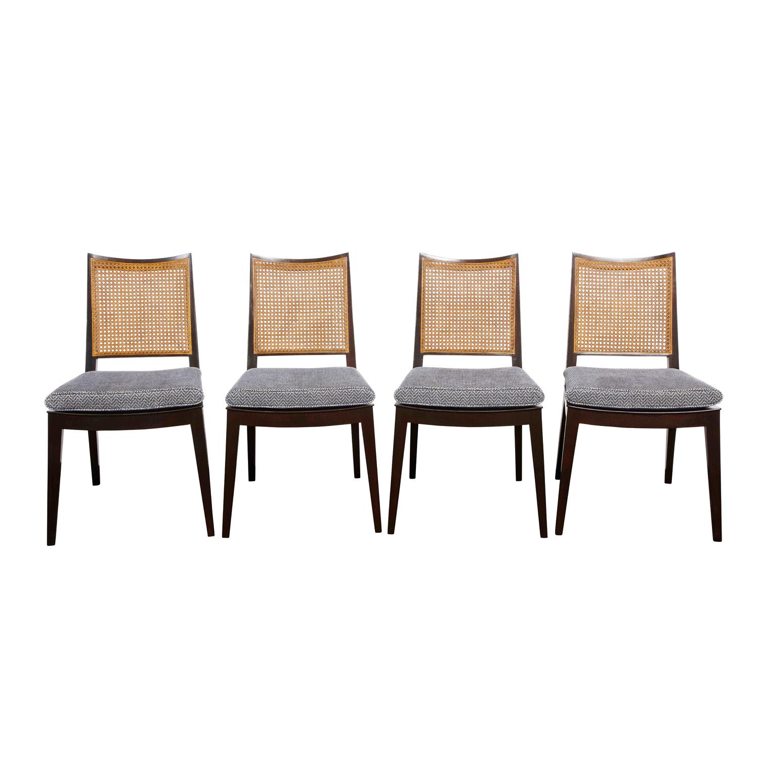 Set of 4 dining/game chairs model 6333 in mahogany with trapezoidal cane backs and newly upholstered seats by Edward Wormley for Dunbar, American 1963. (original Dunbar labels on bottom). These Classic Dunbar chairs are very chic. We have