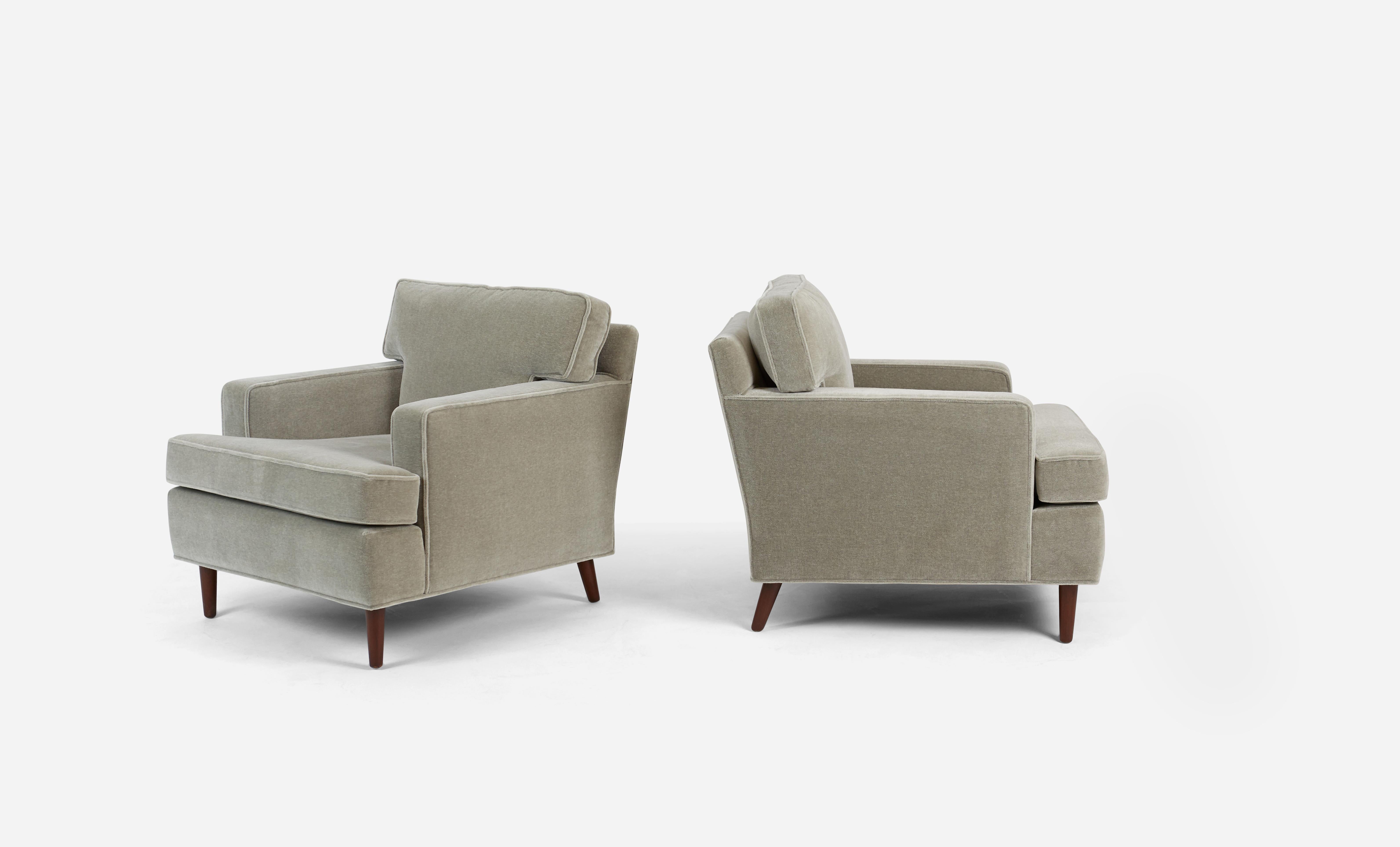 Pair of lounge chairs by Edward Wormley for Dunbar. Fully restored. Mahogany legs refinished in dark walnut tone. Reupholstered in Belgian mohair.