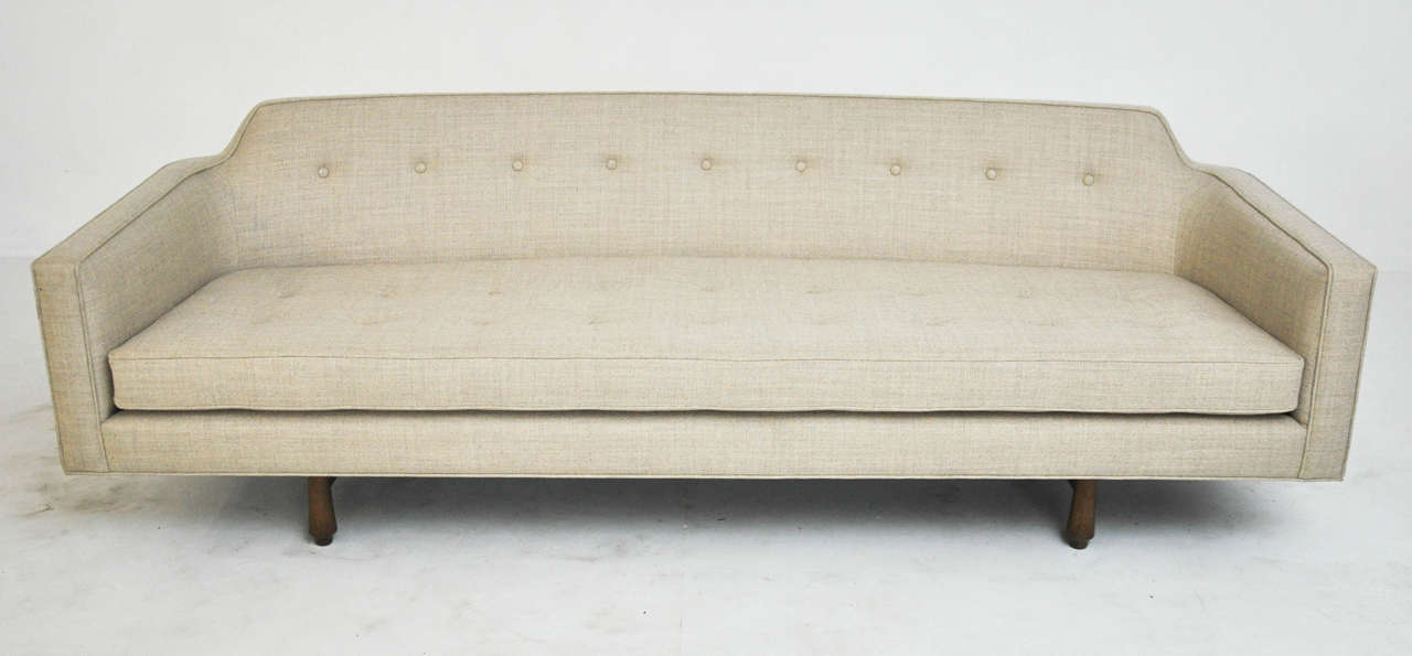 Curved back sofa designed by Edward Wormley for Dunbar. Newly upholstered and bases refinished.