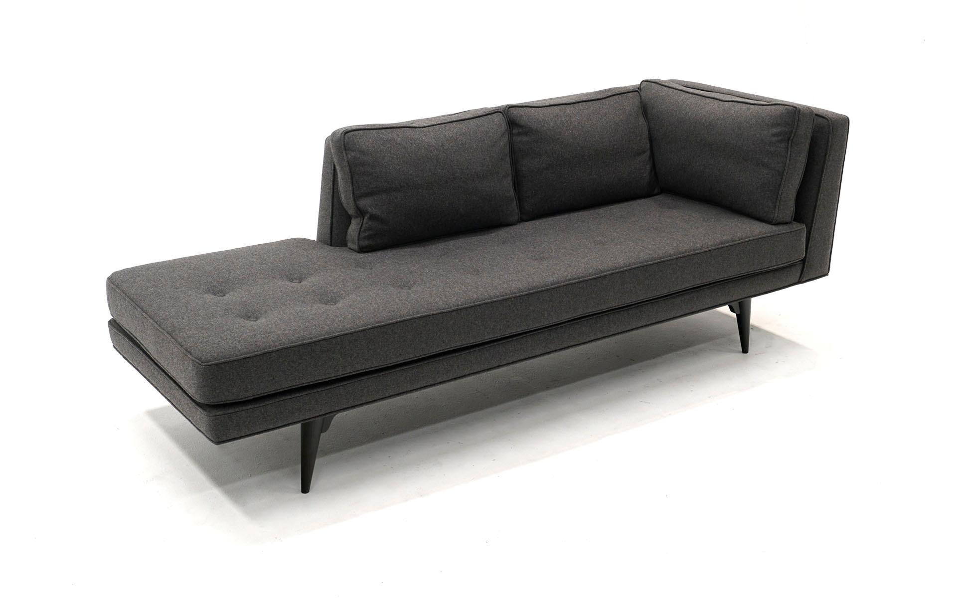 Left arm sofa / chaise longues / lounge designed by Edward Wormley for Dunbar, 1950s. Expertly restored and upholstered in a charcoal fabric with ebonized mahogany frame.