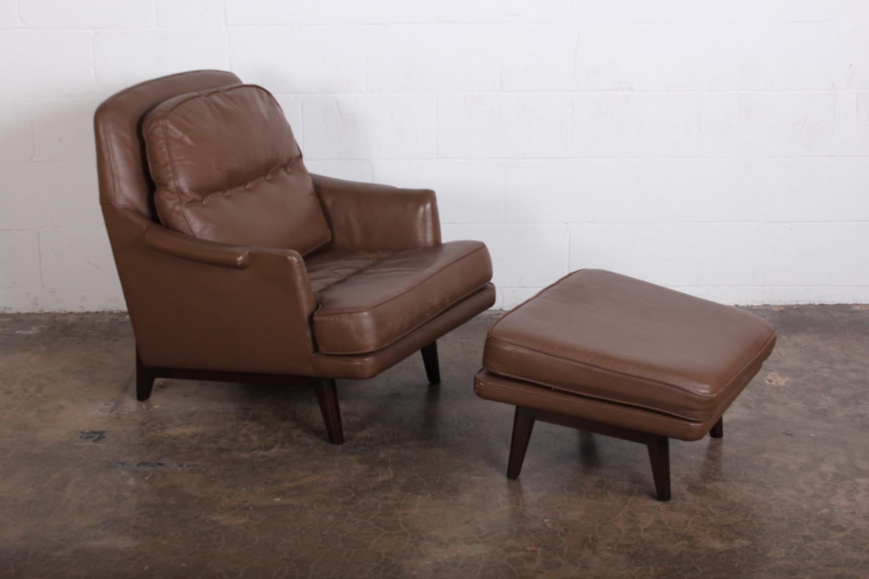 A Dunbar lounge chair and ottoman model 484 designed by Roger Sprunger. Mahogany frame with original leather.